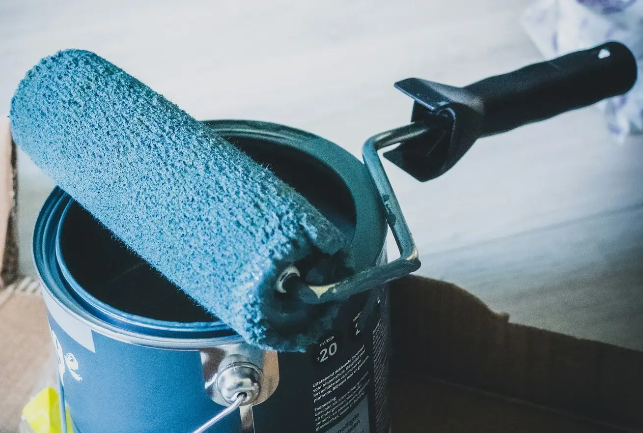 blue and white can on white table