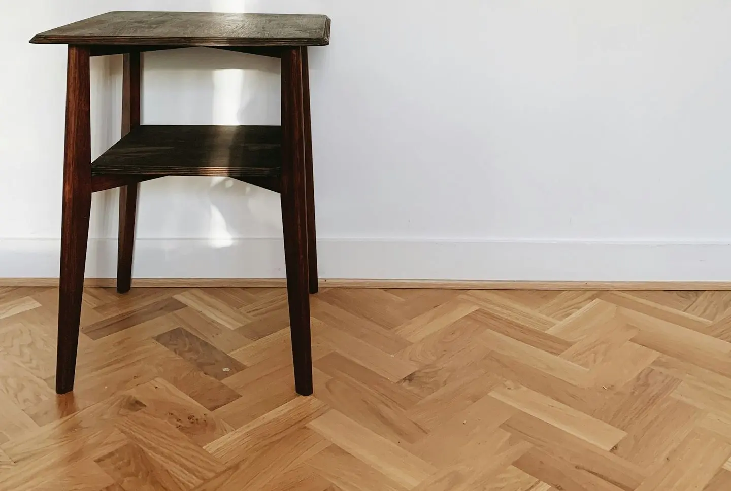 brown wooden seat on brown wooden parquet floor